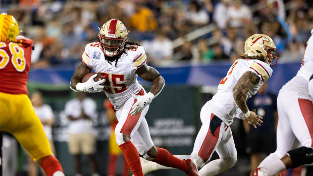 Jul 3, 2022; Canton, OH, USA; Birmingham Stallions running back Bo Scarbrough (25) runs the ball against the Philadelphia Stars during the fourth quarter at Tom Benson Hall of Fame Stadium. Mandatory Credit: Scott Galvin-USA TODAY Sports  
